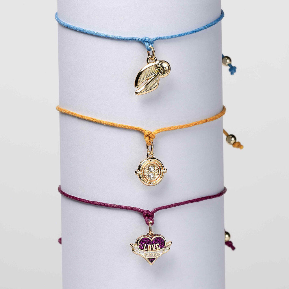 Set de tres pulseras Harry Potter con charms de la snitch, la poción del amor y el girador del tiempo - 3