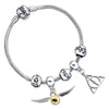 Pulsera plateada de Harry Potter con charms de las Reliquias de la Muerte y Snitch