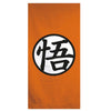 Toalla naranja de Dragon Ball con logo central en blanco y negro