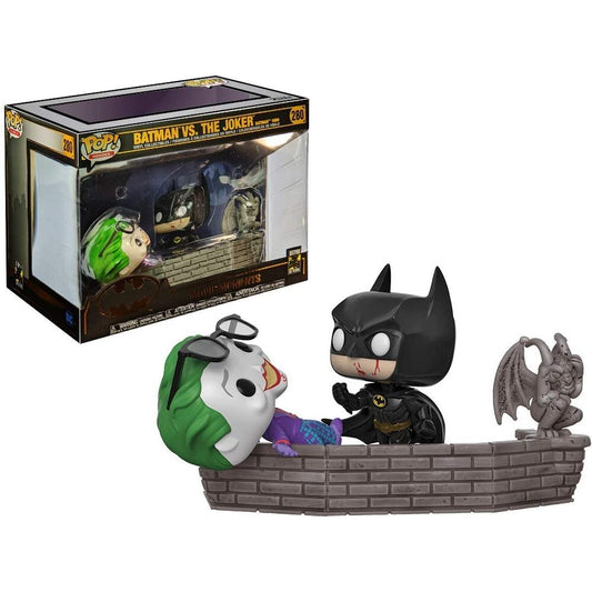 Figura Funko POP de Batman y Joker sobre una cornisa de ladrillo