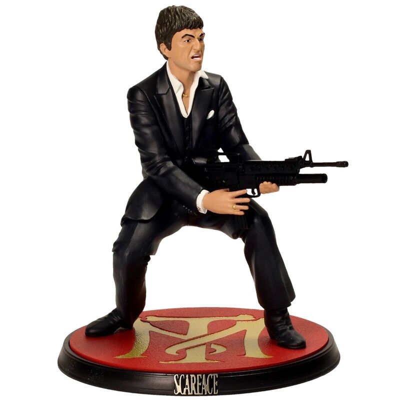 Figura de Tony Montana de Scarface con traje negro sobre base decorada