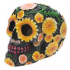 Figura calavera del Día de los Muertos con margaritas de colores