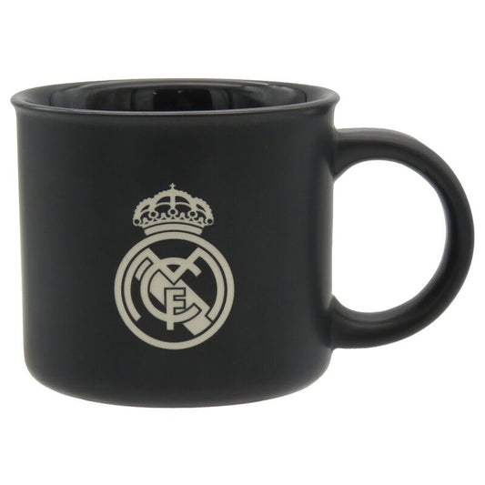 Taza negra del Real Madrid con escudo y asa lateral