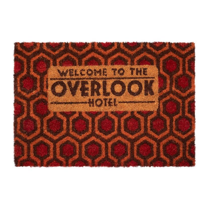 Felpudo del Overlook Hotel de El Resplandor con diseño geométrico rojo y marrón