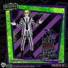 Figura de Beetlejuice con traje de rayas y lápida