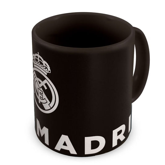 Taza negra ERIK del Real Madrid con escudo y diseño blanco