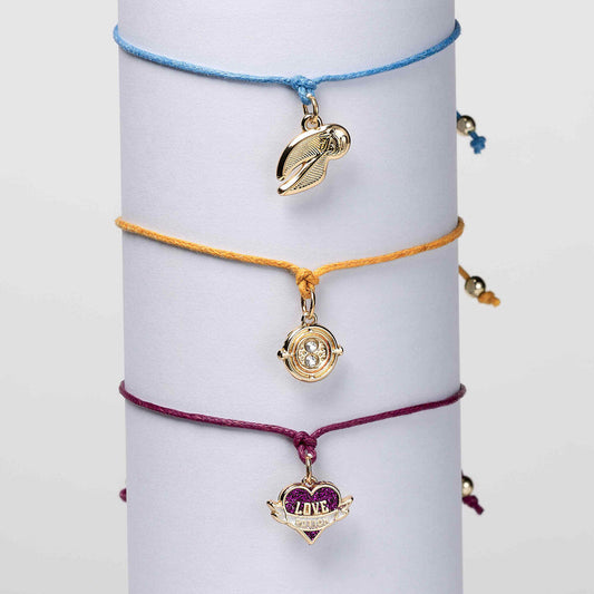 Set de tres pulseras Harry Potter con charms de la snitch, la poción del amor y el girador del tiempo - 3
