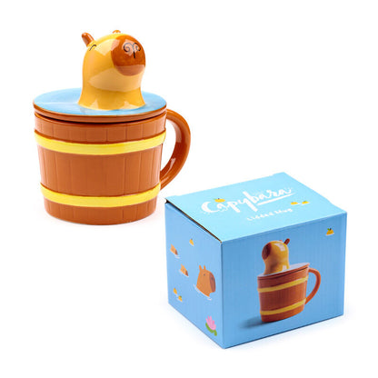 Taza de cerámica PUCKATOR con tapa azul y figura de capibara - 2