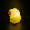 Lámpara nocturna LED con forma de capibara iluminada en amarillo