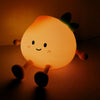 Lámpara nocturna LED con forma de melocotón y rostro sonriente