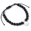 Pulsera Real Madrid negra con cuentas mate y abalorio del escudo