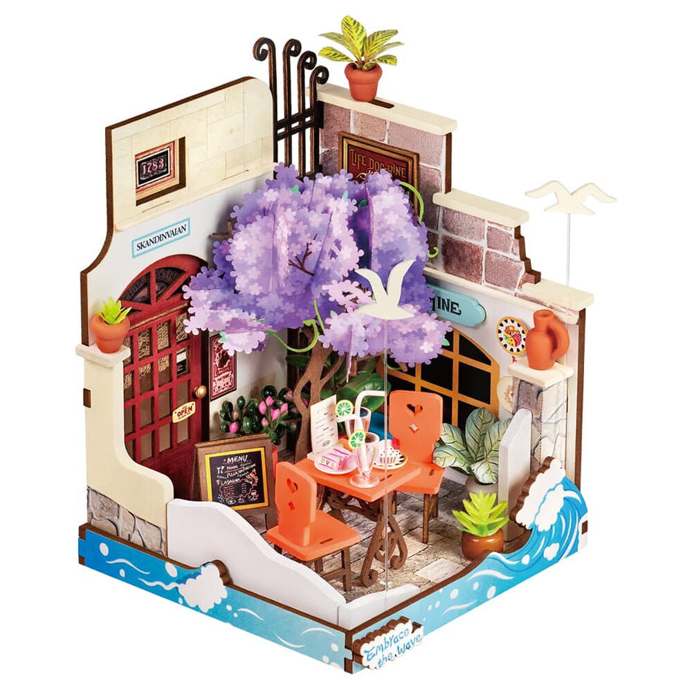 Maqueta Sea Holiday Restaurant de ROBOTIME Rolife con terraza costera y jacaranda en flor