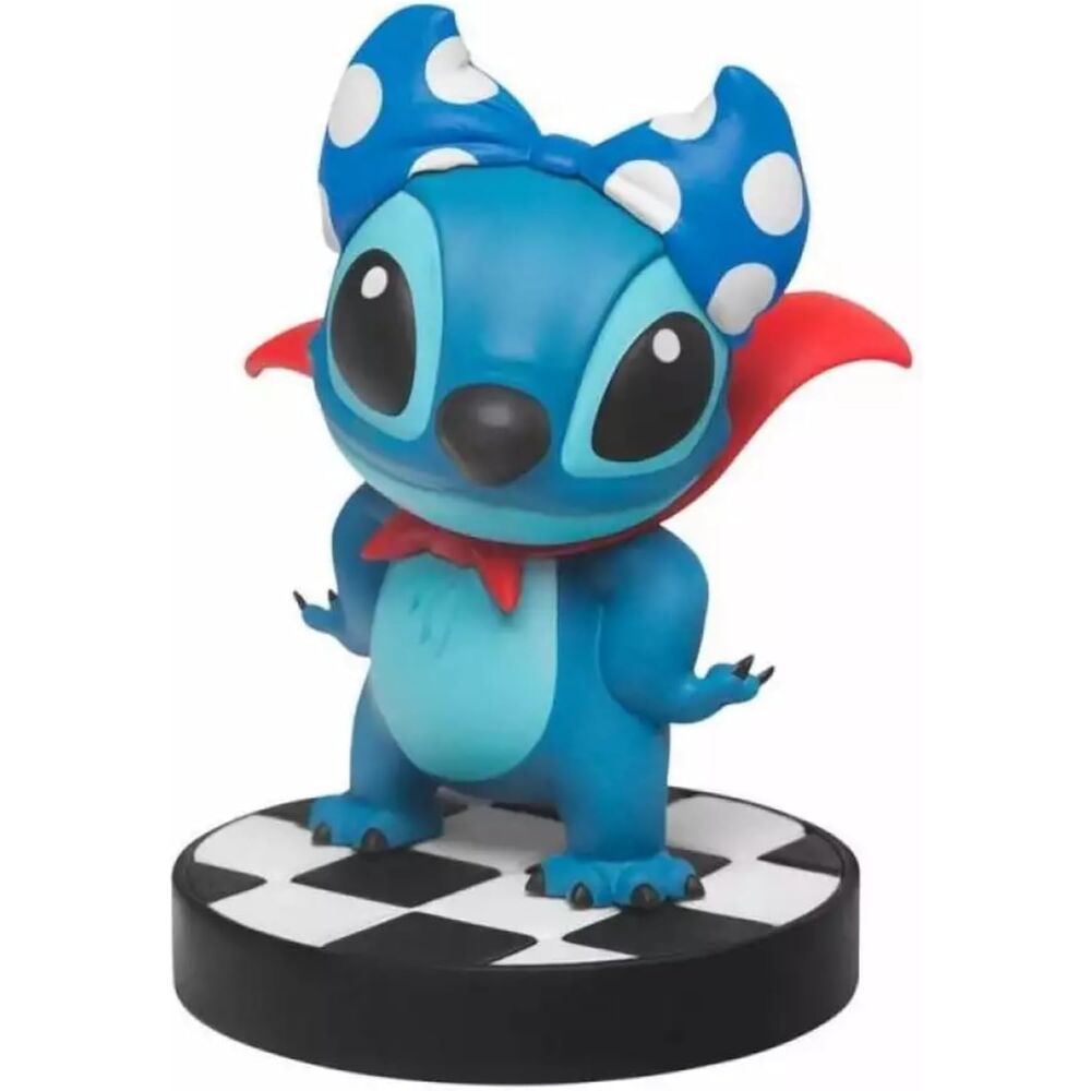 Figura de Stitch Disney con capa roja y lazo azul de lunares