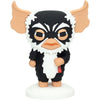 Figura Pokis de George de Gremlins en goma sobre base blanca