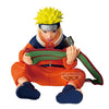 Figura BANPRESTO de Naruto Uzumaki sentado con un pergamino