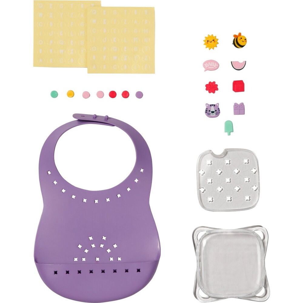 Babero morado Baby Born con pins decorativos