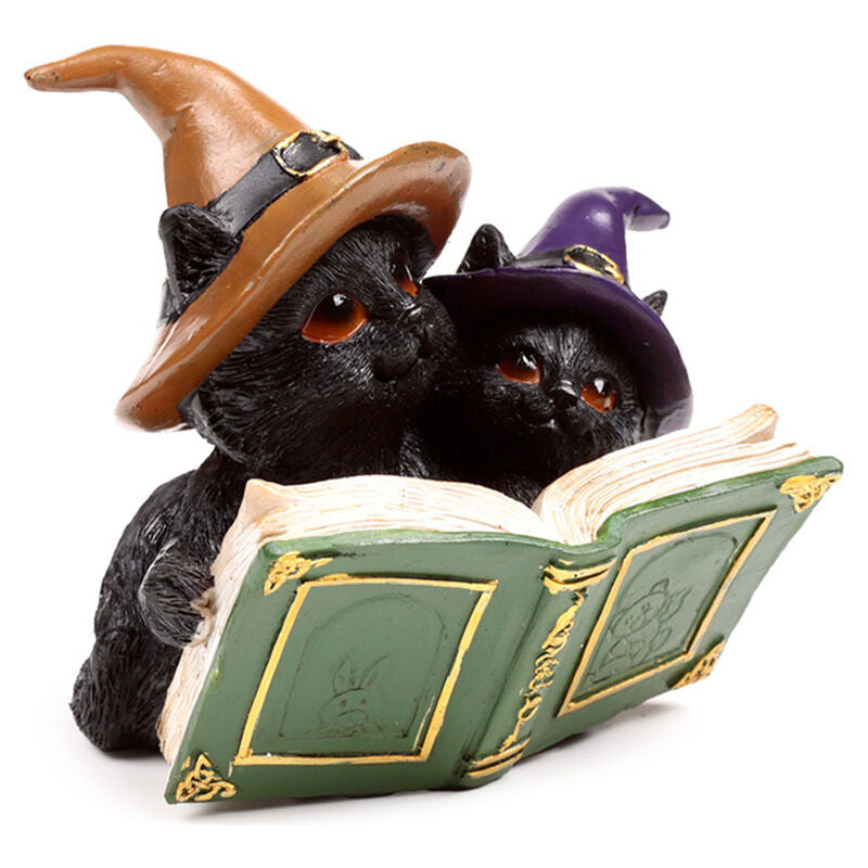 Figuras de gatos negros con sombreros de bruja sobre libros - 2