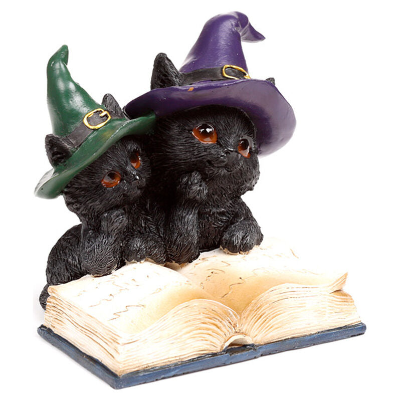 Figuras de gatos negros con sombreros de bruja sobre libros - 3