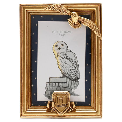 Marco de fotos dorado de Hedwig y Hogwarts