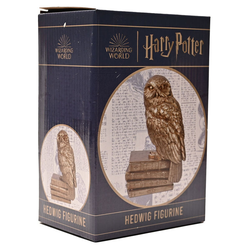Figura dorada de Hedwig de Harry Potter sobre una pila de libros - 4