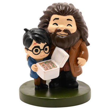 Figura de Hagrid y Harry Potter con una tarta decorada
