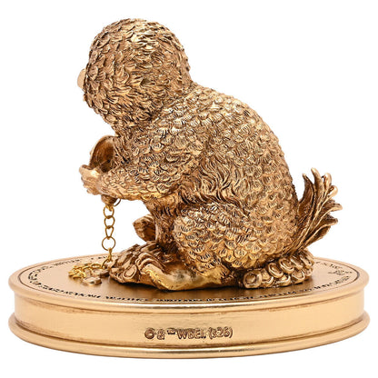 Figura dorada del Niffler de Harry Potter sobre base ovalada - 3