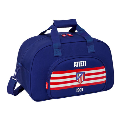 Bolsa de deporte azul marino del Atlético de Madrid con franjas rojas y blancas