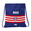 Saco azul del Atlético de Madrid con franjas rojas y blancas