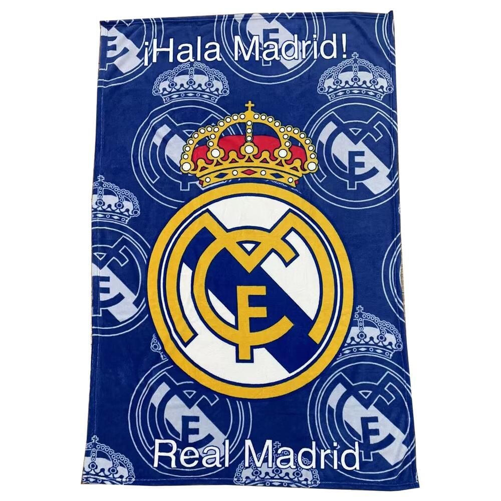 Manta coralina azul del Real Madrid con escudo, coronas y texto «¡Hala Madrid!»