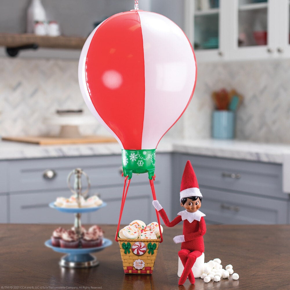 Paseo en globo rojo y blanco de The Elf on the Shelf